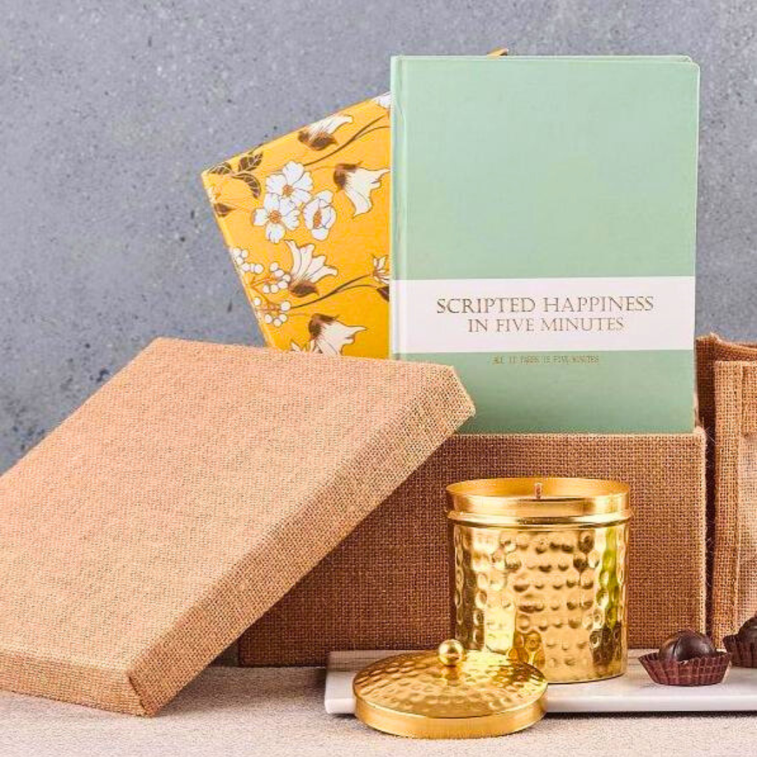 Self care gift hamper with journal, candle and chocolate